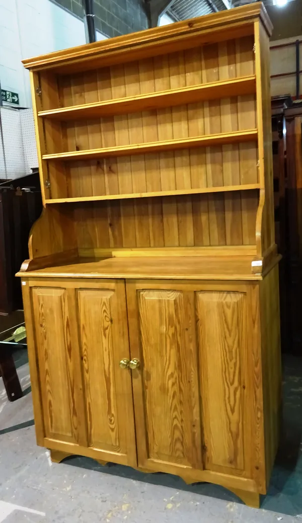 A 20th century pine bookcase cabinet, 120cm wide x 118cm high.   K9