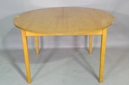 A G Plan style teak circular extending dining table with one internal leaf and a set of four 20th century teak bar back dining chairs, (5), 123cm wide