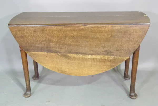 A 19th century oak drop flap dining table on tapering pad supports, 122cm wide x 98cm high.  K4