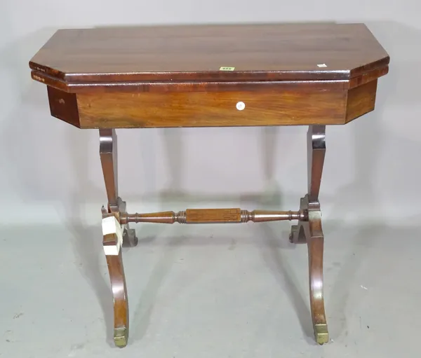 A Regency mahogany tea table, the canted rectangular top on silhouette trestle end standards and four downswept supports, 85cm wide x 76cm high x 41cm