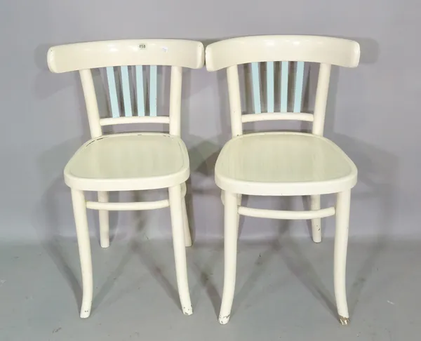 A set of four 20th century white painted bar back dining chairs, (4).   S2T