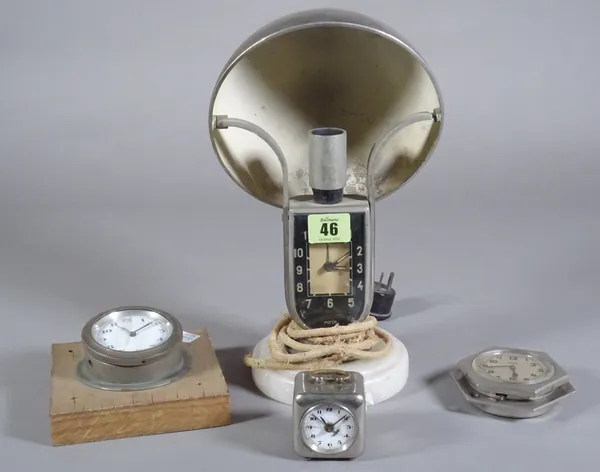 A vintage marble and nickel alarm timepiece table lamp, a car dash mounted timepiece, another octagonal shaped timepiece and a small cube shaped nicke