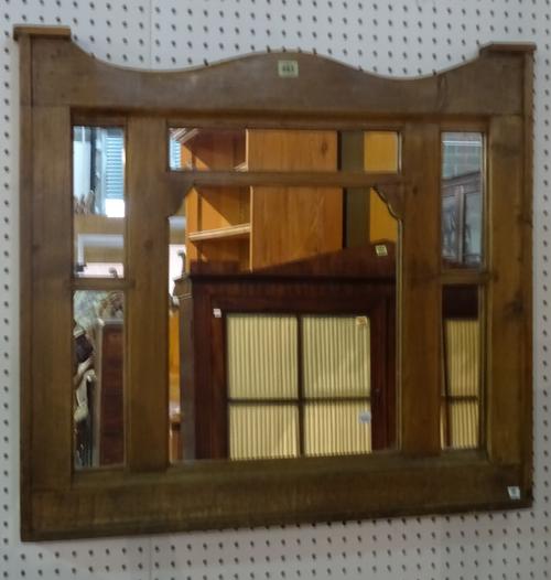 A early 20th century pine marginal arch top wall mirror, 84cm wide x 78cm high.   G10