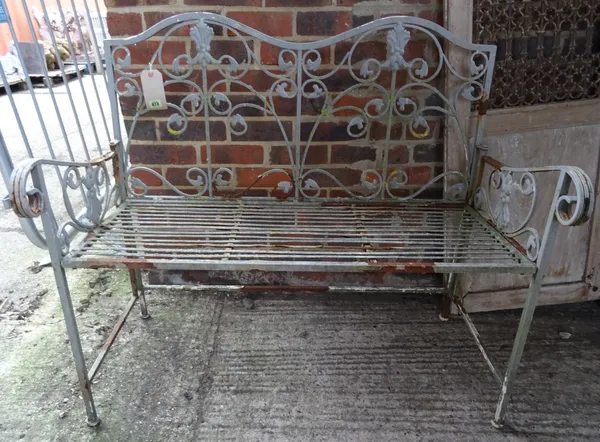 A 20th century grey painted metal hump back garden bench 102cm wide x 92cm high.  OUT