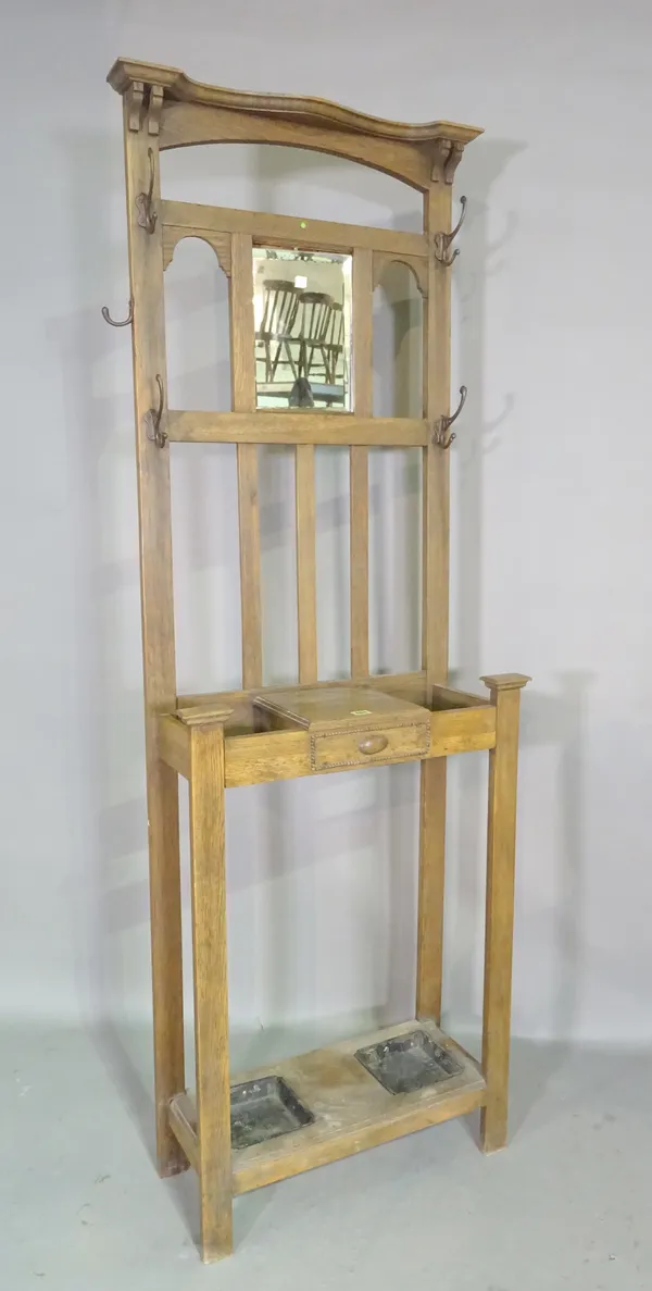An early 20th century oak coat/hall stand, 66cm wide x 182cm high.  K6