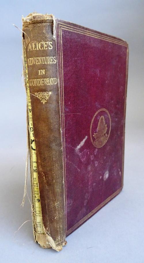Carroll (Lewis) Alice's Adventures in Wonderland, twenty-third thousand, illus., contents pulling, original gilt decorated cloth, rubbed, worn spine s