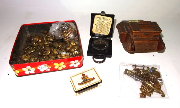 Military collectables including cap badges, buttons, a compass, a money box formed as a tank and sundry.  CAB