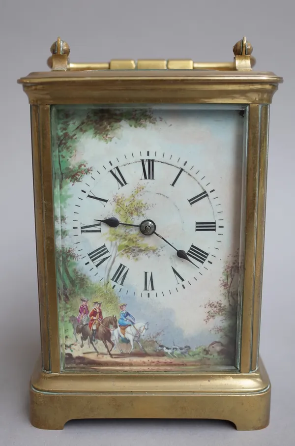 An early 20th century cased carriage clock, with visible escapement and single train movement concealed by a painted porcelain dial, 14cm high. (key)