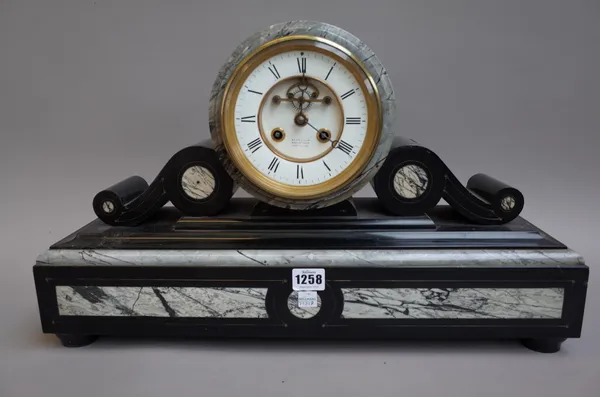 A Victorian black slate and marble inlaid mantel clock, with drum case enclosing a visible escapement detailed 'REED & SON MARKET PLACE CAMBRIDGE', en
