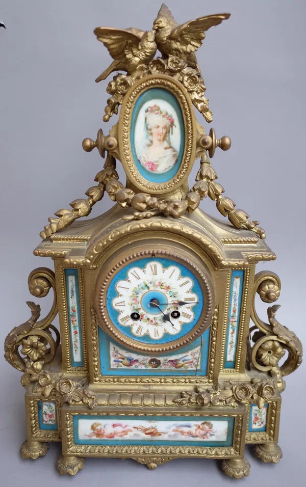 A French porcelain mounted gilt metal eight-day mantel clock, early 20th century, with bird surmount over an oval porcelain miniature plaque and paint