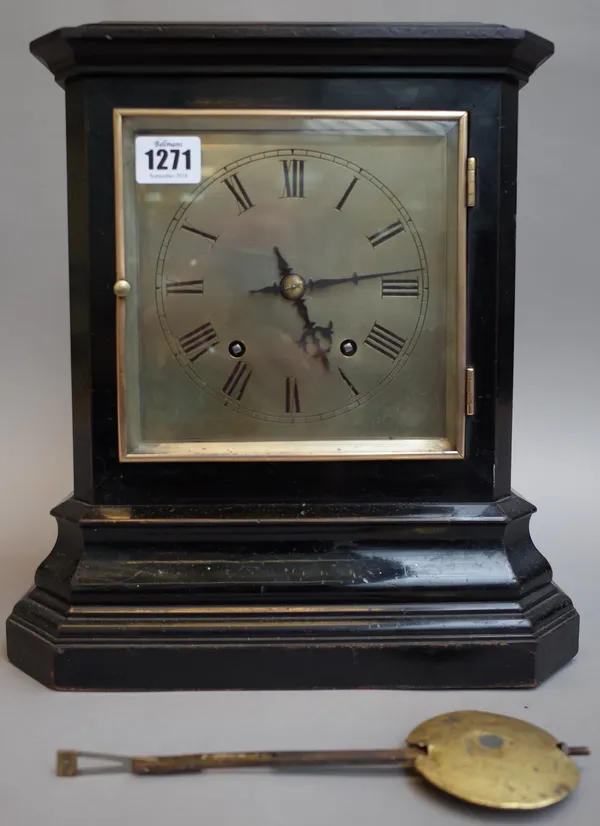 A German ebonised mantel clock, late 19th century, the silvered dial in an ebonised case of canted rectangular form enclosing a W & H Sch two train mo