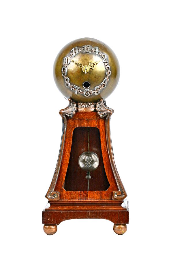 An unusual German Arts & Crafts style mantel clock, the bronzed globular case with applied numbers suspending a globular pendulum within a wooden open