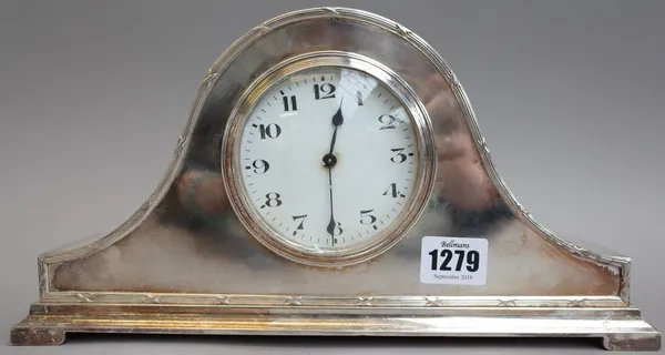 An Edwardian silver plated arch top mantel clock with white enamel dial, 16cm high, a small Lalique style frosted glass mantel clock of cube form, 8cm