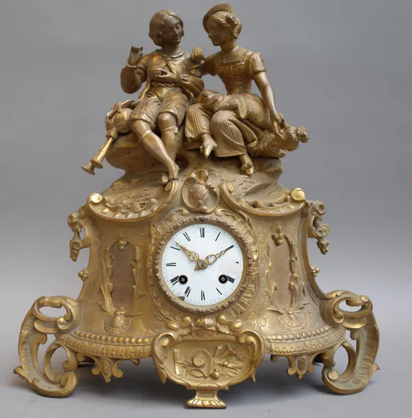 A Louis XVI style gilt metal figural mantel clock, 20th century, surmounted by gallant and companion over a white enamel dial and scroll case enclosin