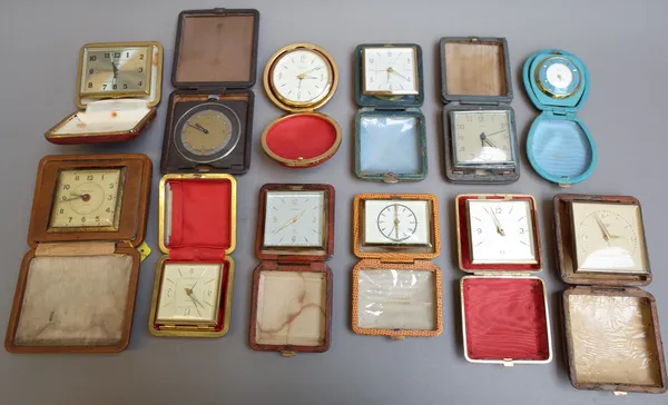 A quantity of late 20th century portable alarm clocks, mostly in folding cases, (qty).
