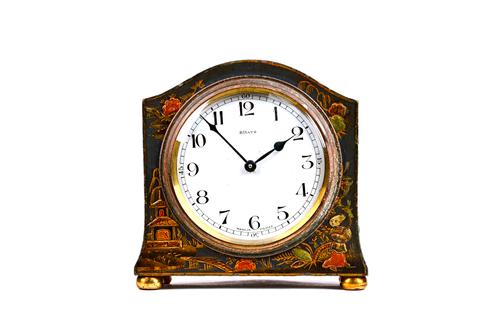 A French chinoiserie decorated 8 day mantel clock, gilt blue against an arch topped body, with enamel dial and Bayard movement, 13cm high. Illustrated