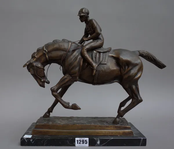 A modern bronze depicting horse and jockey on a naturalistic rectangular base and black marble plinth, 33.3cm high.
