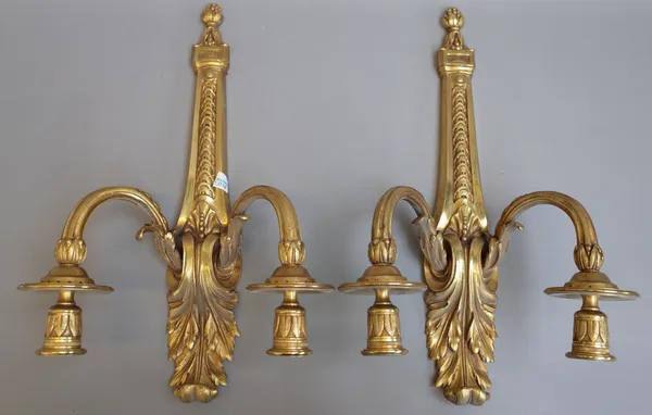 A pair of Victorian style gilt bronze two branch wall appliques, modern, each foliate cast backplate issuing two fluted arms, (backplate 42cm) and a p
