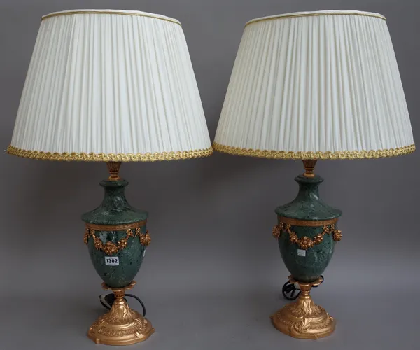 A set of three Victorian green faux marble and gilt metal mounted urn form table lamps, modern, by L'Originale of Italy, with fruiting swag embellishm