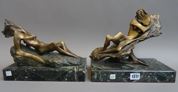A pair of patinated bronze figures, late 20th century, of contemporary stylized form, each recumbent on a rock, signed 'BAPIPA' to the cast and mounte
