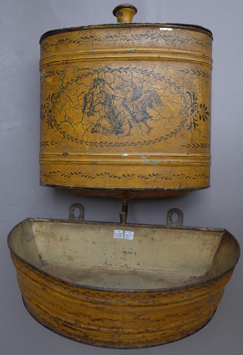 A Regency style tole peinte oval wall font, 20th century, mustard ground with printed classical scenes and separate reservoir, main body 37cm high.