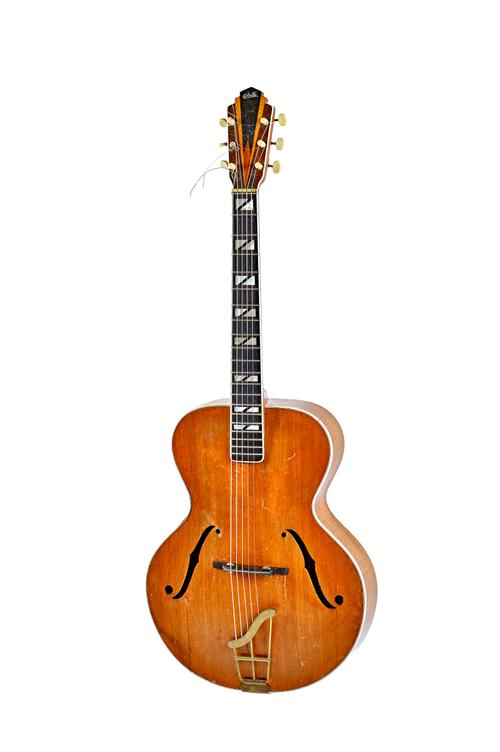 A Coletti archtop acoustic guitar, model G61C, with interior paper label, stamped 'MADE IN GERMANY' and mother-of-pearl inlaid 'Coletti' to headstock.