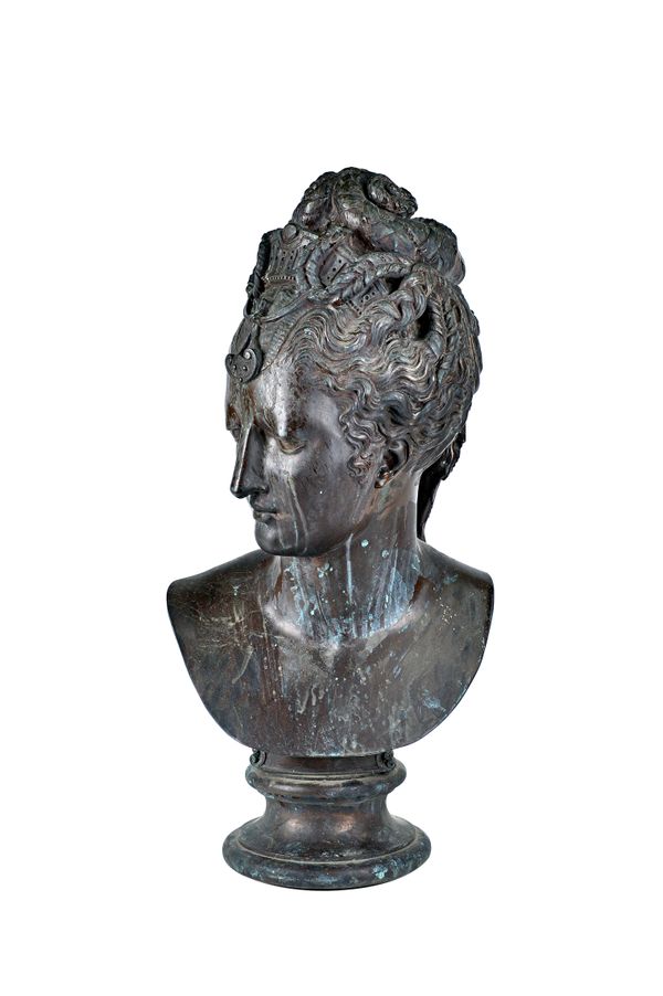 A Victorian style composite bronze bust of Diana, mid/late 20th century, raised on a socle, unsigned .73cm high. Illustrated