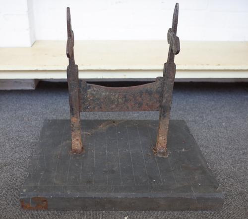 A Victorian Gothic revival cast iron boot scraper on later slate base, 49cm wide x 45cm high.