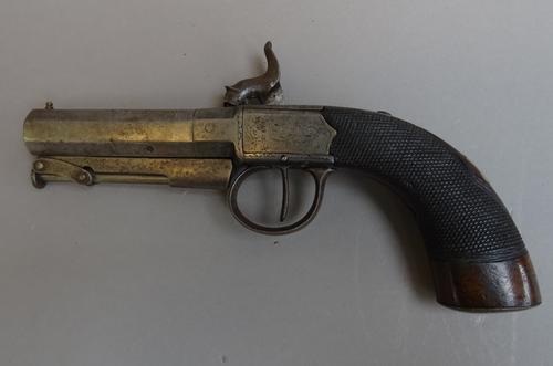 A 19th century percussion pistol with octagonal steel barrel, under lever ramrod, foliate engraved lockplate and a one piece chequered walnut grip, 20