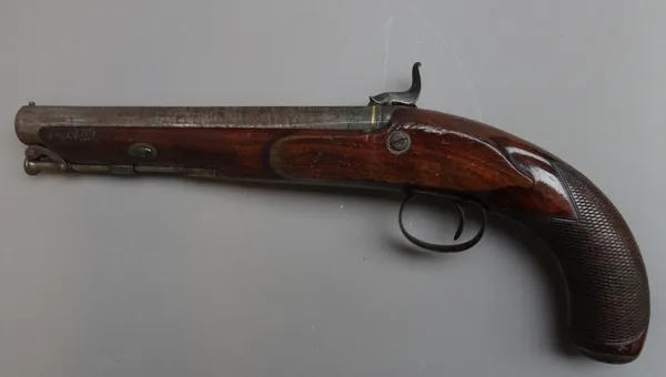 A 19th century percussion pistol by James of London, with circular steel barrel, under lever ramrod, foliate engraved lockplate and a chequered walnut