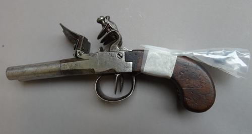 A late 18th century double barrel flintlock travelling pistol with twist off circular tapering steel barrels, plain lockplate and single piece walnut