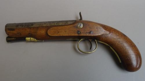 An early 19th century percussion overcoat pistol by Trulock & Son, Dublin, converted from flintlock, octagonal steel barrel, wooden ramrod, foliate en