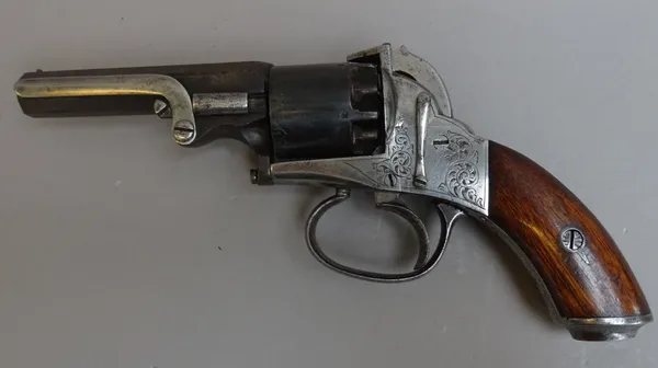 A five shot percussion revolver, circa 1850, 9mm bore, side rammer, foliate engraved lockplate and a two piece walnut grip, 22cm overall.
