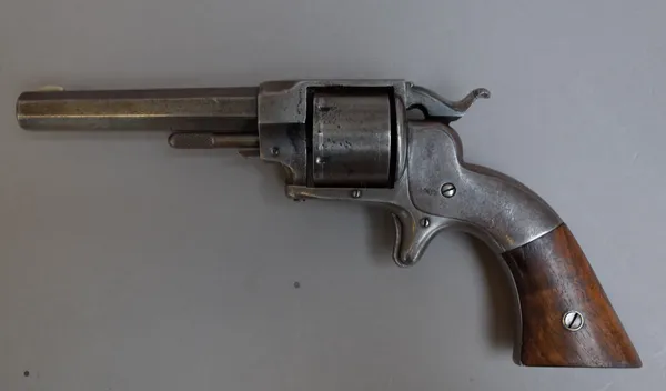 An Ethan Allen side hammer six shot cylinder revolver, circa 1861, with octagonal barrel, plain body and two piece walnut grip, 22.5cm overall.
