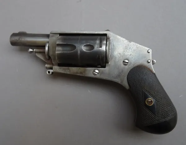 A Belgian 5.5mm five shot Velodog revolver, late 19th century, circular steel barrel, folding trigger, concealed hammer and two piece finely chequered