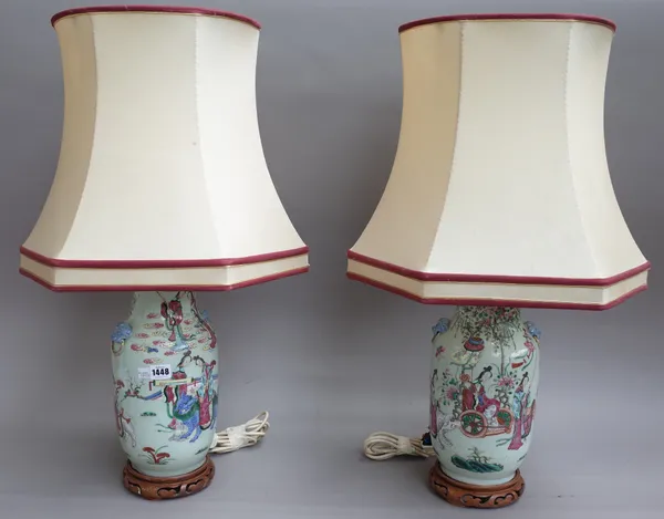 A pair of Chinese Canton porcelain vase table lamps, 19th century each with twin dog of fo handles decorated with figures and animals against a landsc