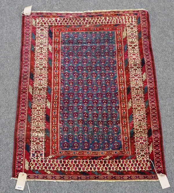An unusual Yomut rug, Turkman, the indigo field with an allover boteh design, an ivory delicate flowering plant, side border and boteh end border, 132