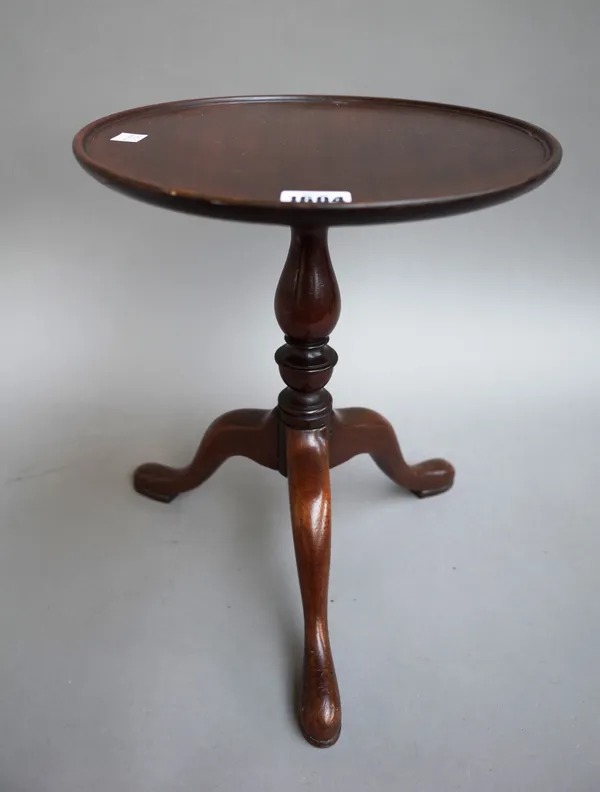 A diminutive mahogany tripod table with circular dish top and baluster column, 28cm diameter x 34cm high.