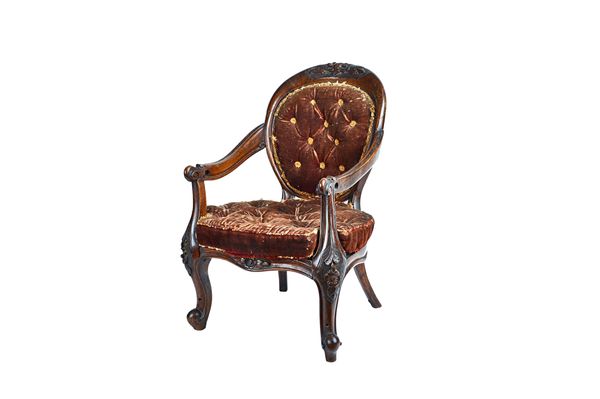 A diminutive Victorian walnut framed spoon back open armchair on floral carved scroll supports, 43cm wide x 61cm high. Illustrated