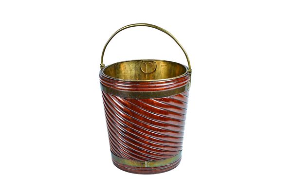 A 20th century spiral fluted brass bound hardwood oyster bucket of mid-18th century style, 38cm diameter x 59cm high (including handle). Illustrated