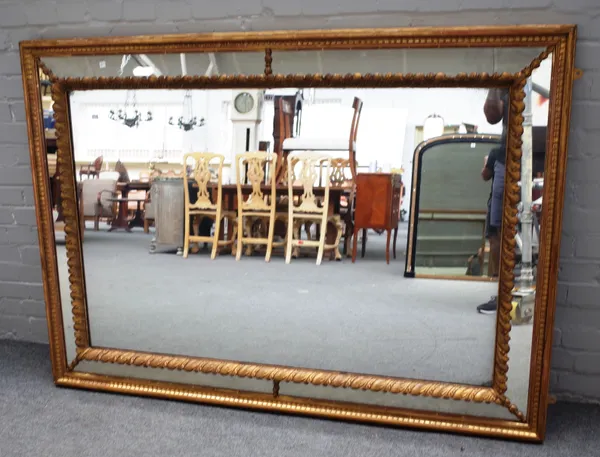 A 19th century gilt cushion framed rectangular mirror, with marginal border, 119cm wide x 170cm high