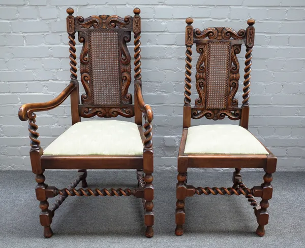 A set of early 20th century mahogany and beech dining chairs, each with opposing scroll carved crest over barleytwist supports, to include a pair of c