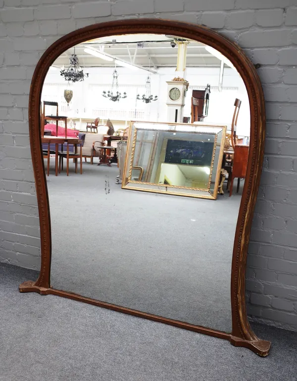 A late 19th century gilt framed balloon shaped overmantel mirror with egg and dart moulded frame, 160cm wide x 159cm high.