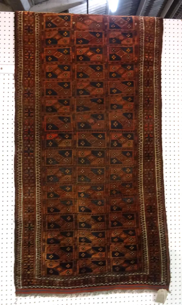 An Ersari rug, the madder field compartmented with a flower head border, 166cm x 87cm  E6