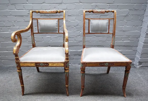 A set of eight Regency style dining chairs, with faux painted wood grain finish, on splayed turned supports, to include a pair of carvers, (8).