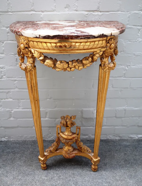 A mid-19th century French console table, the 'D' shape marble top on a gilt floral mounted base of two tapering fluted supports, 57cm wide x 82cm high