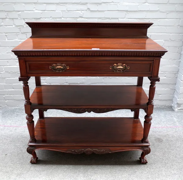 Maple & Co Ltd; a late 19th century walnut buffet, with one long drawer over a pair of open tiers with reeded and fluted columns, on ball and claw fee