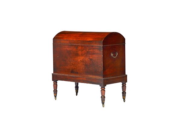 A large George III mahogany dome top cellarette on turned supports, 70cm wide x 72cm high x 38cm deep. Illustrated