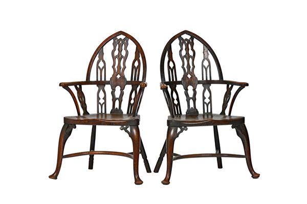 A pair of Strawberry Hill Gothic Revival ash and elm open arm Windsor chairs, with solid seat and crinoline stretcher, 61cm wide x 108cm high (2). Ill