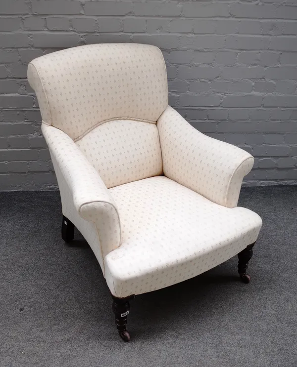 A Victorian easy armchair with outswept rollover arms on beehive turned supports, 80cm wide x 90cm high.